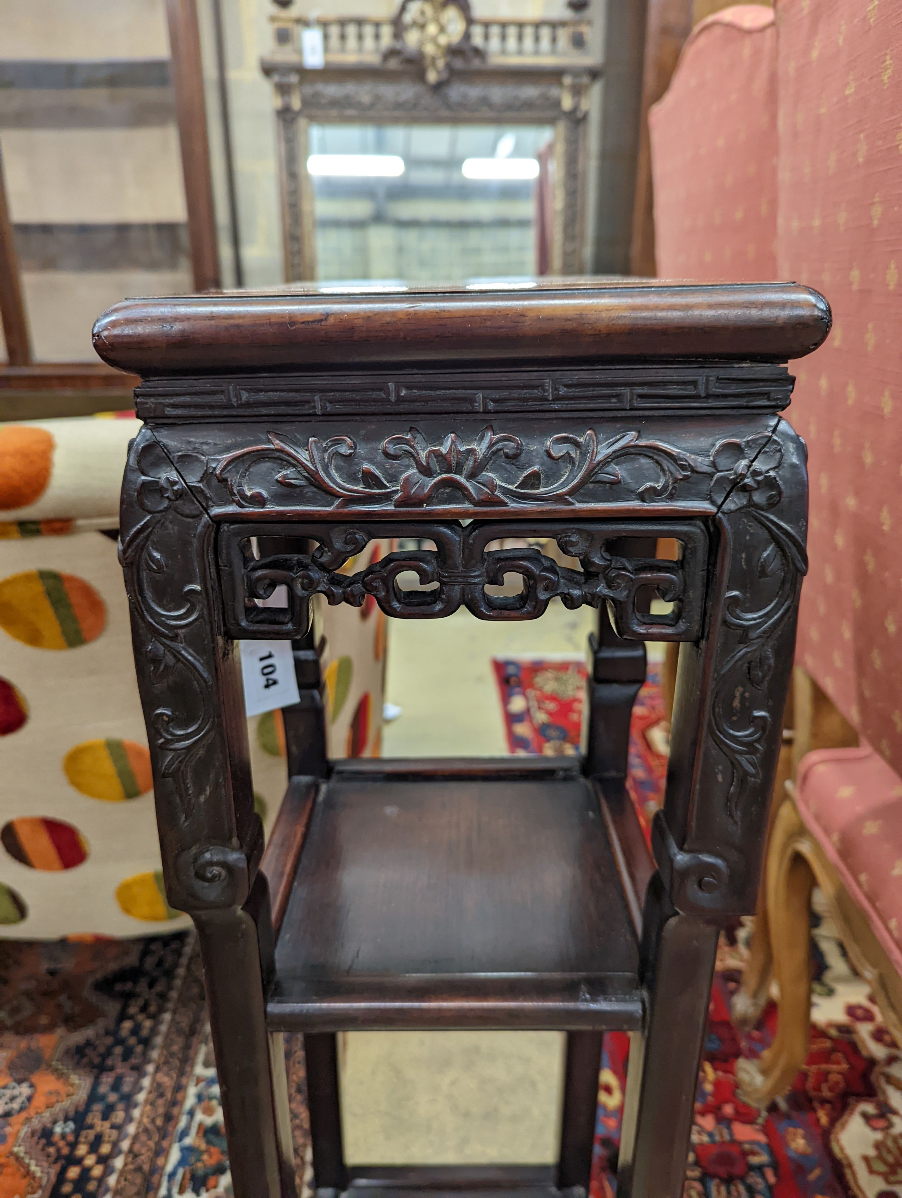 A Chinese carved hardwood three tier jardiniere stand, marble inset, width 22cm, depth 22cm, height 82cm